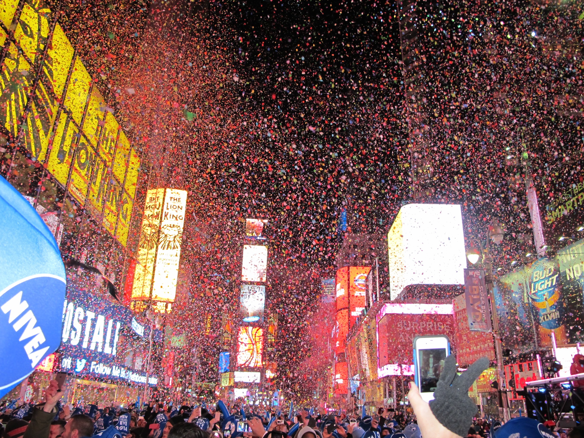 City,Night,Lights,New York,New Year's Eve,Celebration,Confetti falling at Times Square after the ball drop.