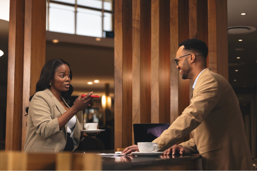 A woman and a man talking.