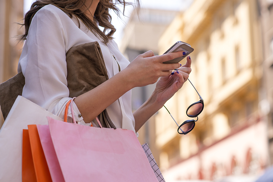 Women carrying shoppings bags and using smartphone, Retail, Shopping, Women, Only Women, Fashion, texting, smartphone, city